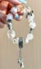 Multi-crystal bracelet worn, silver & crystals arrange, metal-water energy shows ethereal layers