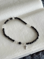 Close-Up of Silver Obsidian & Clear Quartz Bracelet, Silver Charms Mix with Black-White Gems, Water-Metal Energy Hides Balance Philosophy