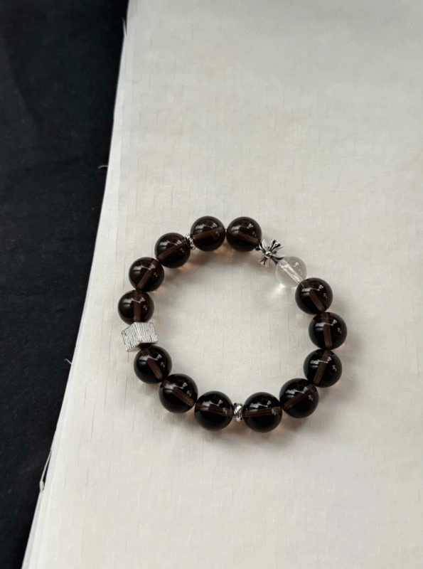 Close-up of obsidian bead! Shiny black like night, silver sheen in light