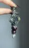 Design close-up of Jiangzi bracelet, silver carvings & multi-stones, earth-fire-metal energy in knots