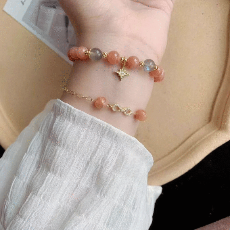 Layered orange moonstone bracelet, gold star charm & blue moonstone beads, fire-metal energy brightens skin