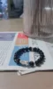 Golden obsidian men’s bracelet on newspaper, 999 silver pixiu charm, water-metal energy for wealth