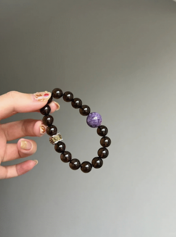 Display of 10mm Smoky Quartz & Charoite Bracelet, Metal Accents & Smoky Mix, Earth-Wood-Metal Energy Shows Balance Philosophy