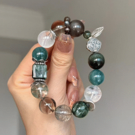 Hands Holding Metal-Water-Wood Bracelet, Green Dragon Crystal & Silver Rutilated Quartz Weave, Wood-Water-Metal Resonance Manifestation