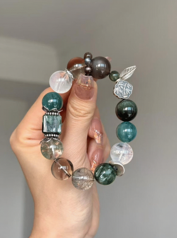 Hands Holding Metal-Water-Wood Bracelet, Green Dragon Crystal & Silver Rutilated Quartz Weave, Wood-Water-Metal Resonance Manifestation