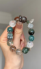 Hands Holding Metal-Water-Wood Bracelet, Green Dragon Crystal & Silver Rutilated Quartz Weave, Wood-Water-Metal Resonance Manifestation