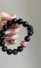 Detail of Obsidian Bracelet, Pixiu Carving & Rhodochrosite, Earth-Fire Protection