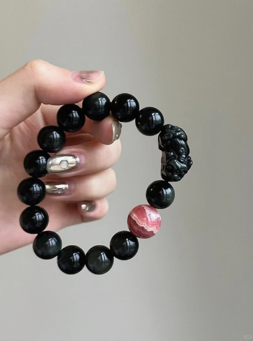 Detail of Obsidian Bracelet, Pixiu Carving & Rhodochrosite, Earth-Fire Protection