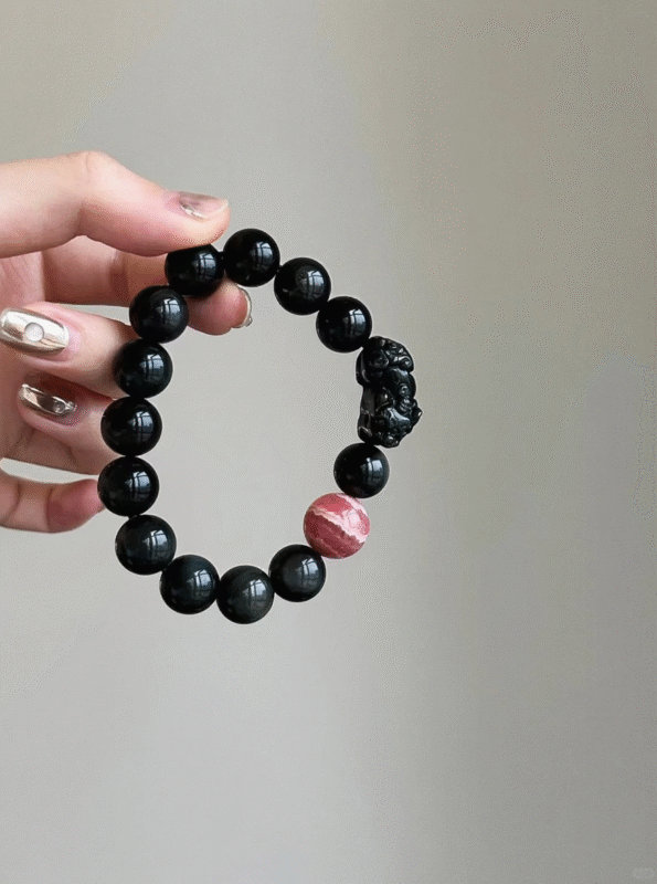 Hands Displaying Obsidian, Pixiu & Rhodochrosite Bracelet, Black-Red Clash, Water-Fire-Earth Energy Blend