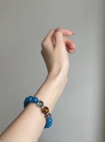 Close-Up of 10mm Blue Apatite Bracelet, Peacock Blue Reveals Water Energy Code