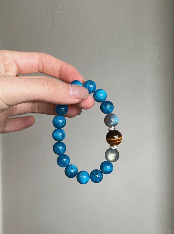 Wrist-Worn Blue Apatite Bracelet, Phosphorescent Glow & Tiger-Moon Resonance, Water-Earth Energy Manifests