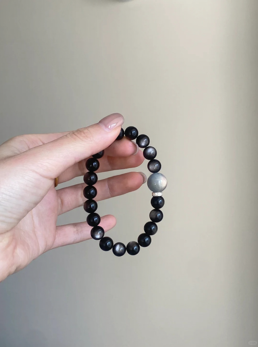 Close-Up of 8mm Silver Obsidian Bracelet, Silver Sheen Reveals Water Energy Code
