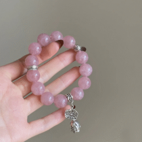 Close-Up of Madagascar Rose Quartz Bracelet, Pink Glow Reveals Fire-Metal Code