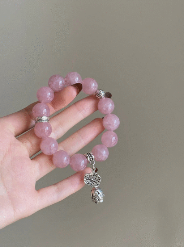 Close-Up of Madagascar Rose Quartz Bracelet, Pink Glow Reveals Fire-Metal Code