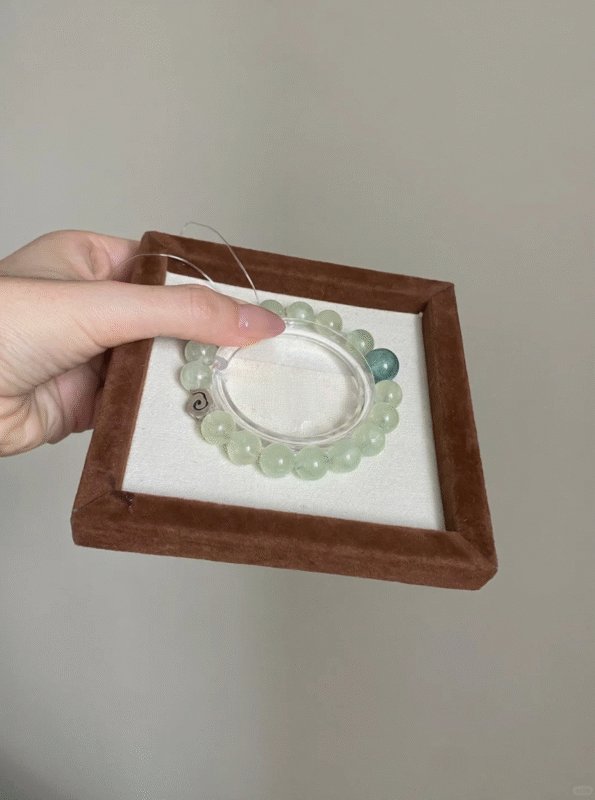 Close-Up of Prehnite & Monet Crystal Bracelet, Wood-Water Blend Manifests