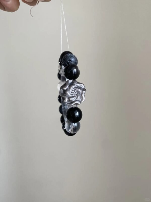 Close-Up of Silver Obsidian Carving, Rose Totem Hides Protection Power