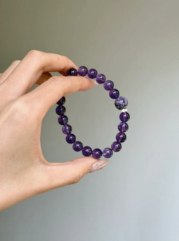 Close-Up of 10mm Amethyst Bracelet, Texture Reveals Fire Energy Code