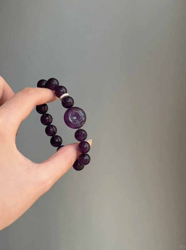 Hand Displaying 10mm Uruguayan Amethyst Peace Buckle Bracelet, Water Energy Awakens Wisdom & Protection