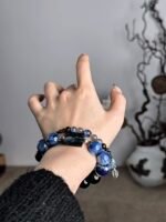 Hand Displaying Layered Blue Bracelet, Multi-Crystal Sync Awakens Fate Resilience