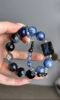 Hand Displaying 14mm Multi-Blue Gem Bracelet (Pietersite Square, Pietersite Round), Water-Metal-Earth Energy Activates Creative Field