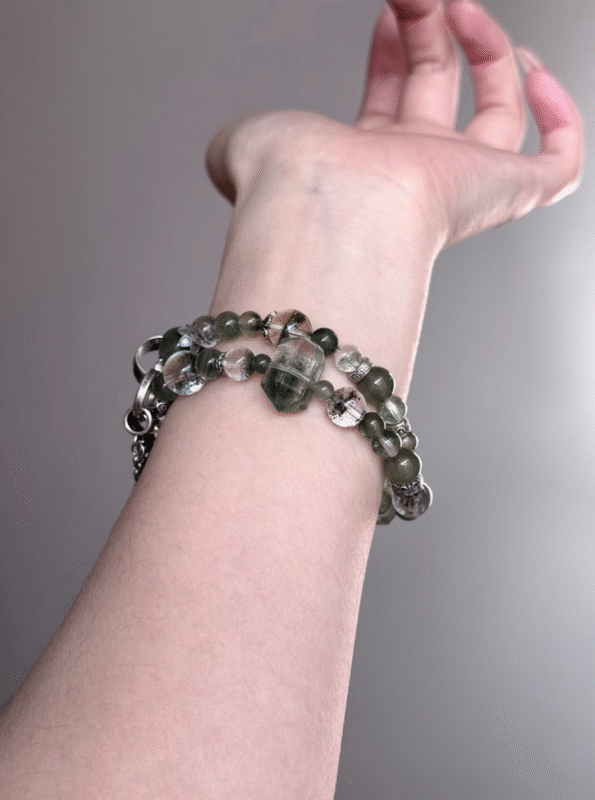 Hand Displaying Green Rutilated Quartz Details, Silky Strands Ignite Creativity