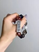 Hand Displaying Neo-Chinese Tea Crystal × Red Phantom Bracelet, Earth-Fire-Metal Energy Awakens Inner Power