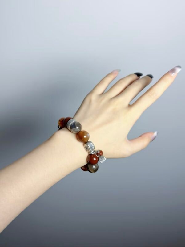 Hand Displaying Red Rutilated Details, Fire Veins Ignite Action