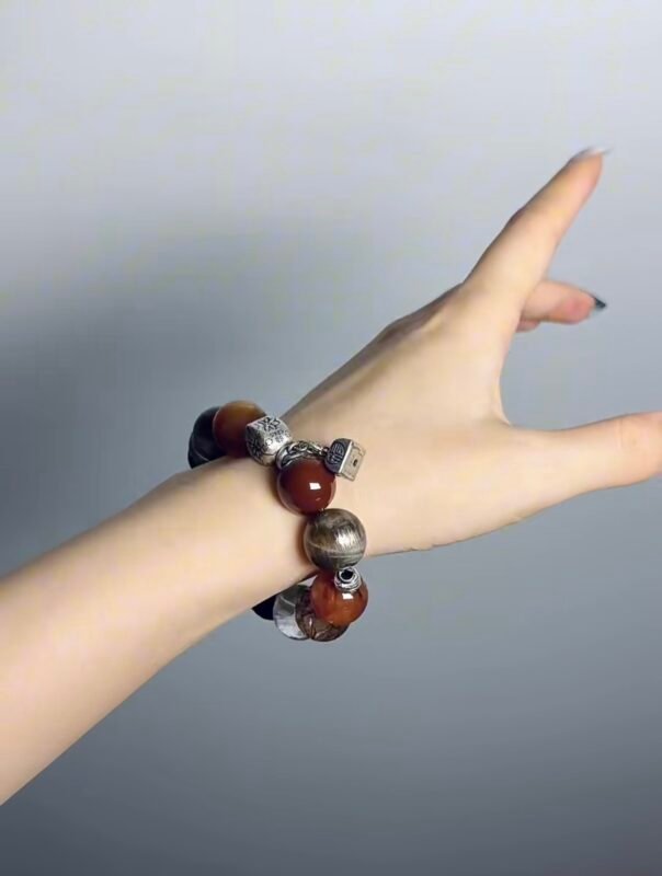 Hand Displaying Mars-Series Crystal Bracelet (Red Rutilated, Black Gold Super Seven), Fire-Metal Energy Awakens Courage