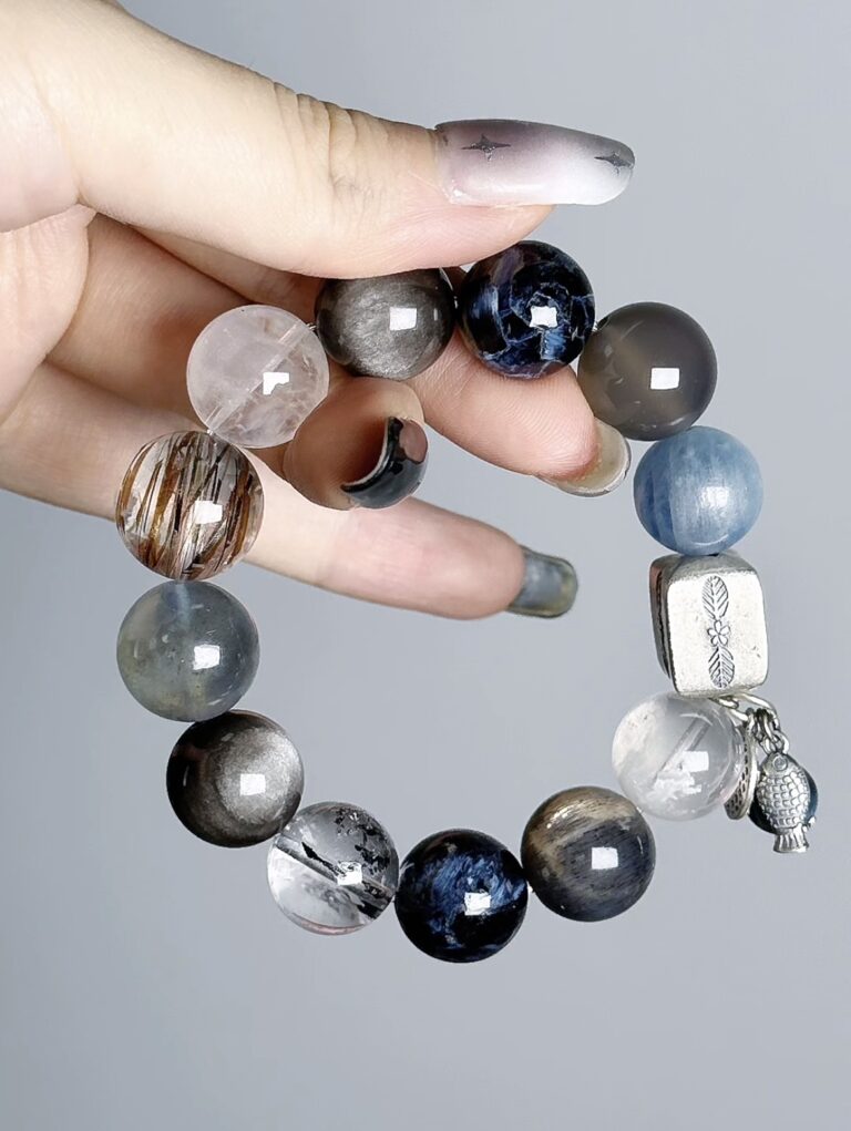 Hand Displaying Earth 2.0 Blue Crystal Bracelet (Kyanite, Aquamarine), Water-Metal Energy Awakens Cosmic Connection