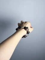 Hand Displaying Black Flash Aquamarine Details, Water Veins Ignite Spiritual Insight