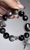 Layered Bracelet Close-Up, Metal-Earth-Water Sync Boosts Mental Toughness