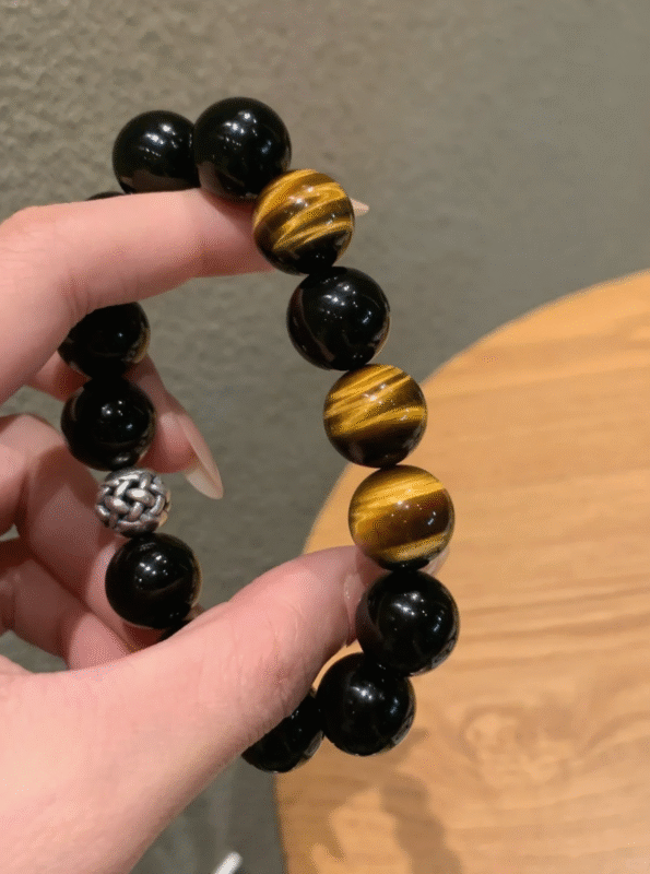 Hand Close-Up of Yellow Tiger’s Eye, Earth Veins Ignite Courage Energy