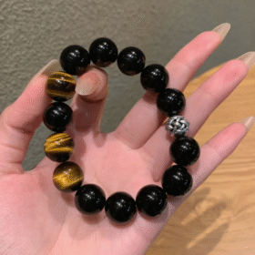 Hand Displaying 12mm Black Obsidian & Yellow Tiger’s Eye Bracelet, Water-Metal-Earth Energy Clashes Protection & Courage Field