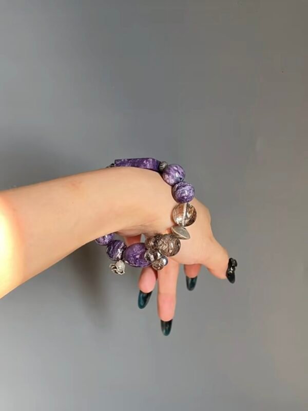 Hand Displaying Bracelet Layers, Metal Veins Seal Energy Cycle