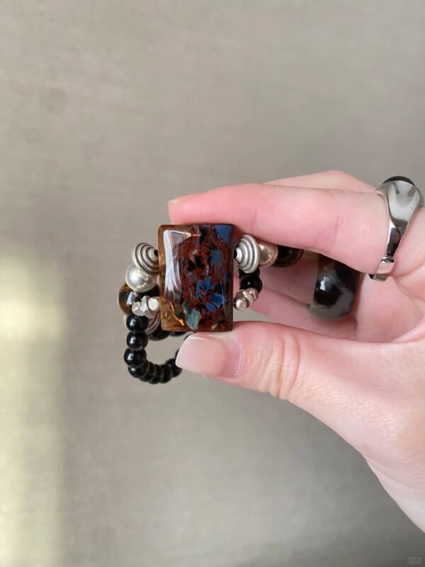 Close-Up of Pietersite Pendant, Fire Veins Hold Courage Blade