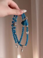 Close-Up of Blue Apatite Bracelet, Water Veins Hold Communication Blade