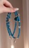 Close-Up of Blue Apatite Bracelet, Water Veins Hold Communication Blade