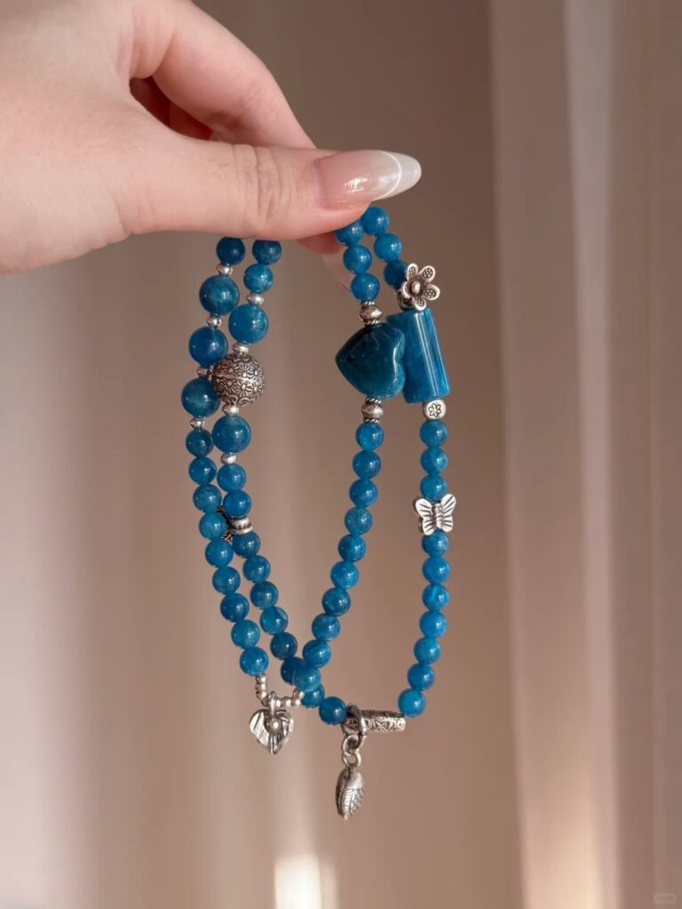 Close-Up of Blue Apatite Bracelet, Water Veins Hold Communication Blade