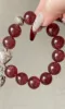 Close-Up of Star Strawberry Quartz Bracelet, Attraction Codes In Wood-Metal
