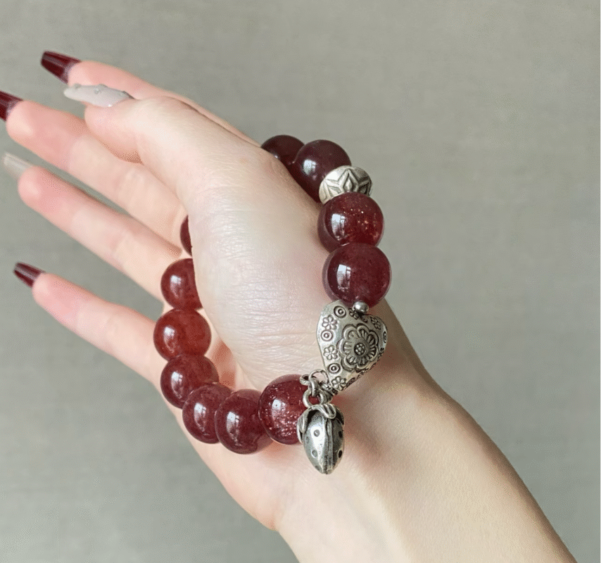 Detail of Star Strawberry Quartz Bracelet, Wood-Metal Attraction Engine Activates