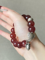Detail of Star Strawberry Quartz Bracelet, Wood-Metal Attraction Engine Activates