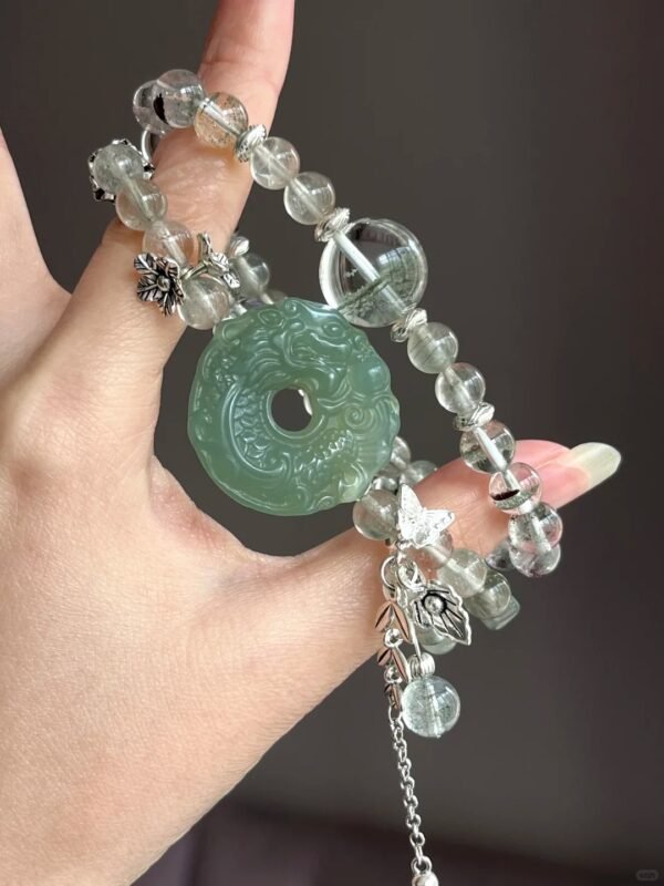 Hand-Showing Green Rutilated Accent Bead, Vitality Codes In Wood Veins