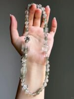 Hand-Showing Green Rutilated Accent Bead, Vitality Codes In Wood Veins