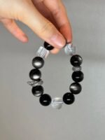 Holding Silver Obsidian Bracelet, Silver Dragon Ring’s Protective Energy Awakening