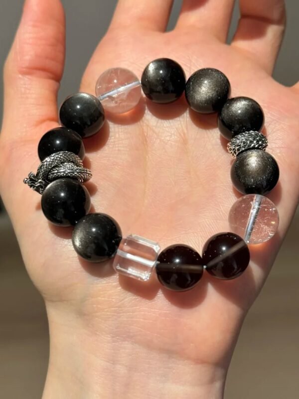 Holding 13.8mm Double-Eye Silver Obsidian, White Azeztulite, 13mm Smoky Quartz, Clear Quartz Cube Bracelet With Silver Dragon Ring & Scale Spacers, Water-Metal-Earth Energies Intertwine