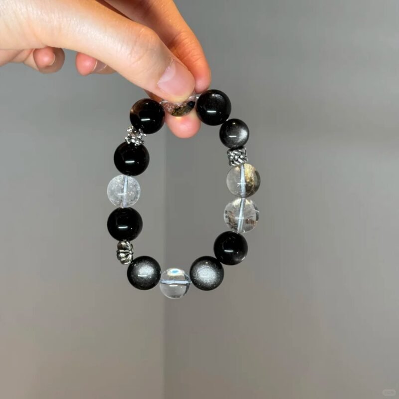 Holding Silver Obsidian Bracelet, Silver Demon-Slaying Pestle & Chrome Hearts Protective Energy Awakening