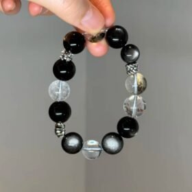Holding Silver Obsidian Bracelet, Silver Demon-Slaying Pestle & Chrome Hearts Protective Energy Awakening