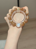 Holding Orange & Blue Moonstone Bracelet, Silver-Gold Accents Amplify Fire-Water Sync Sharpness