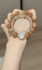 Holding Orange & Blue Moonstone Bracelet, Silver-Gold Accents Amplify Fire-Water Sync Sharpness