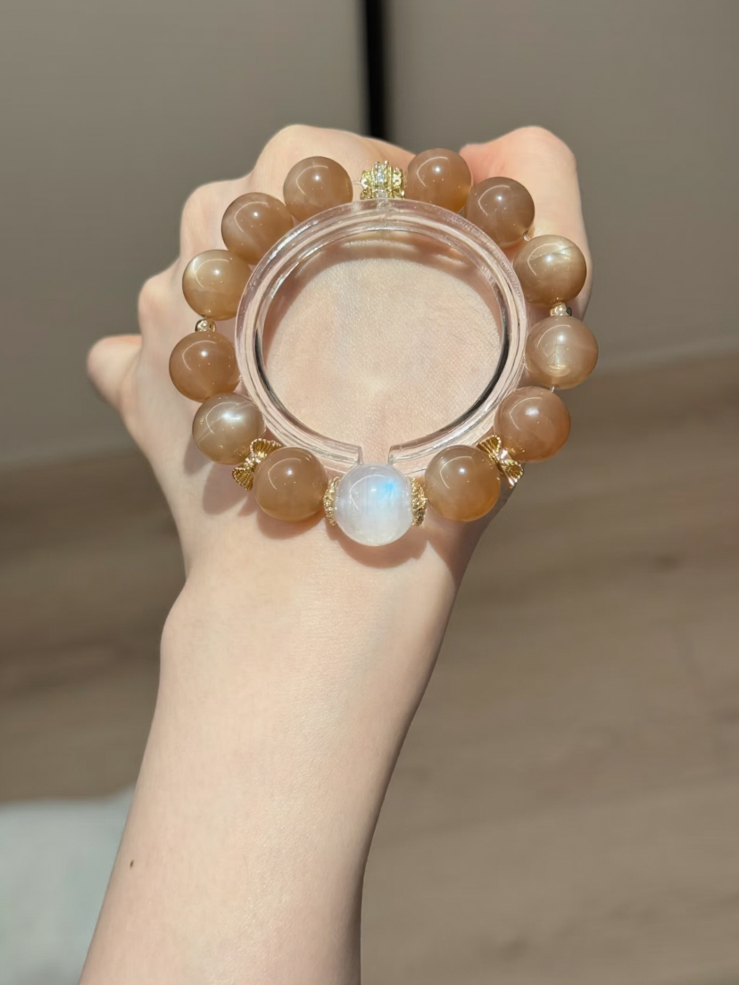 Holding Orange & Blue Moonstone Bracelet, Silver-Gold Accents Amplify Fire-Water Sync Sharpness